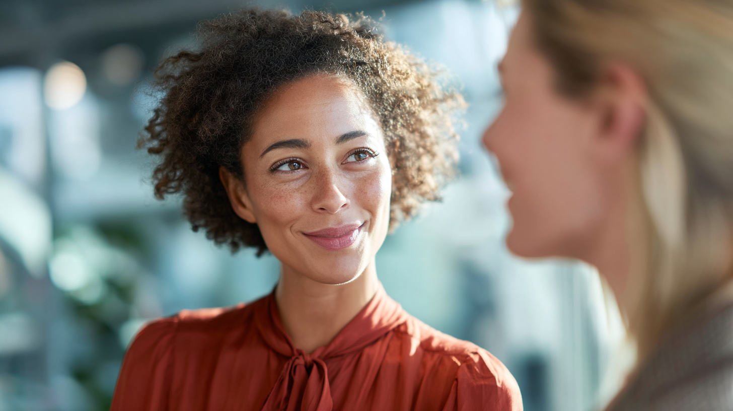 Diverse Women Engaging in Casual Business Conversation