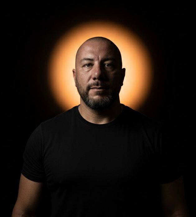 Dark Studio Portrait with Orange-Gold Halo