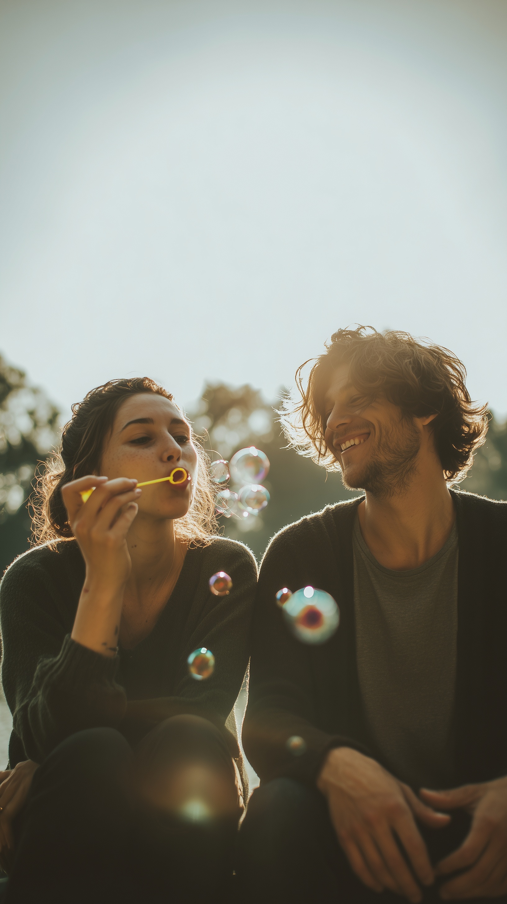 Colorful Portrait of Adults Blowing Bubbles Outdoors