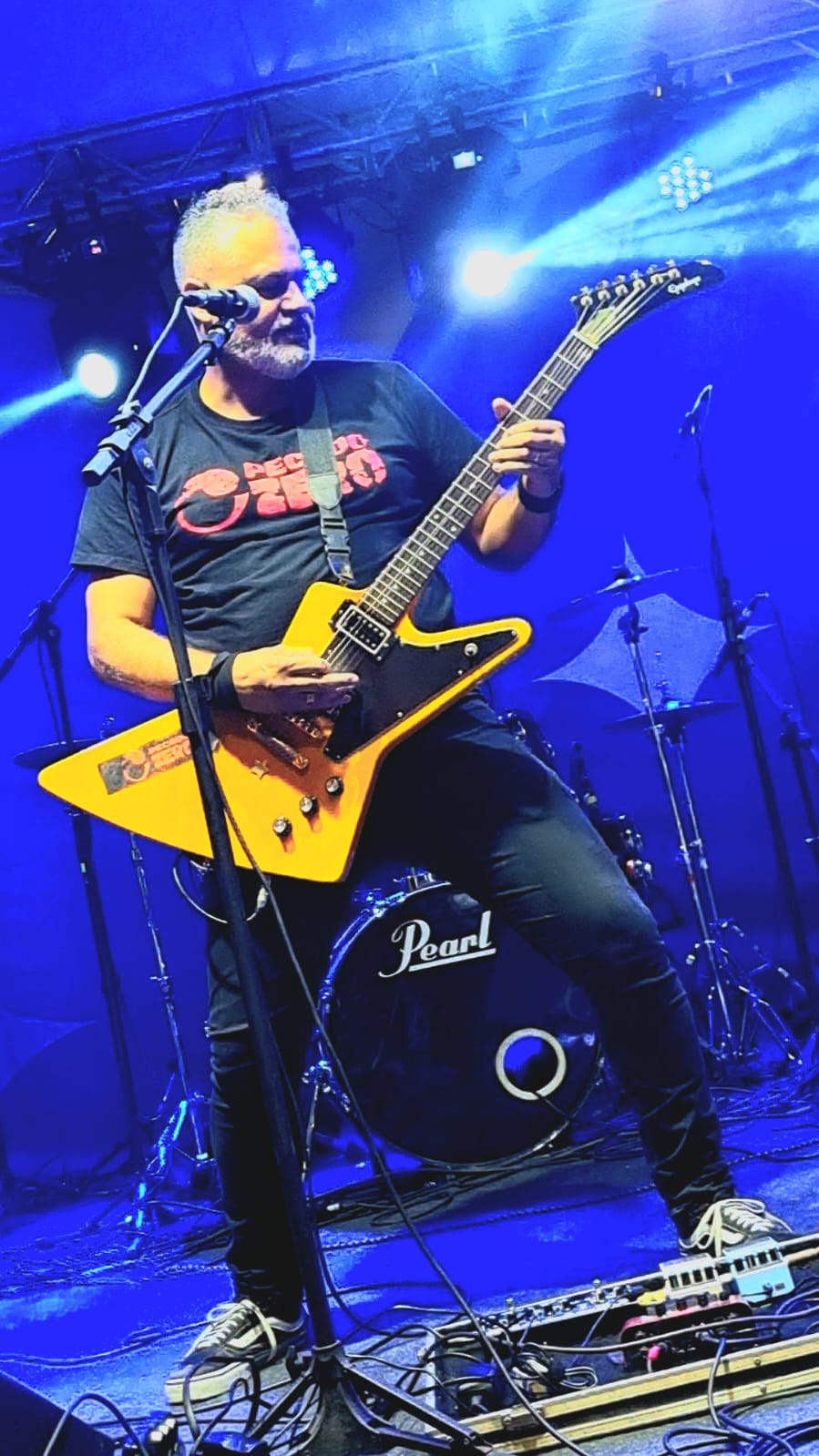 Urban Noir: Man in Neon-Lit City Scene